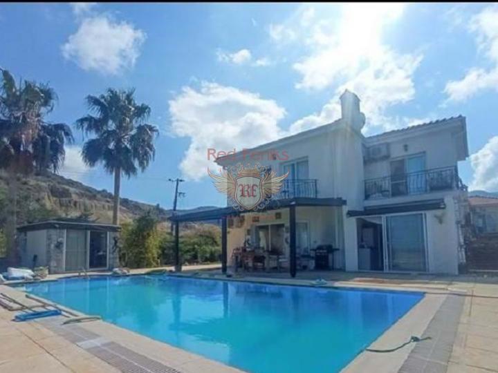 This classic style villa located in a tranquil area of Bahceli.